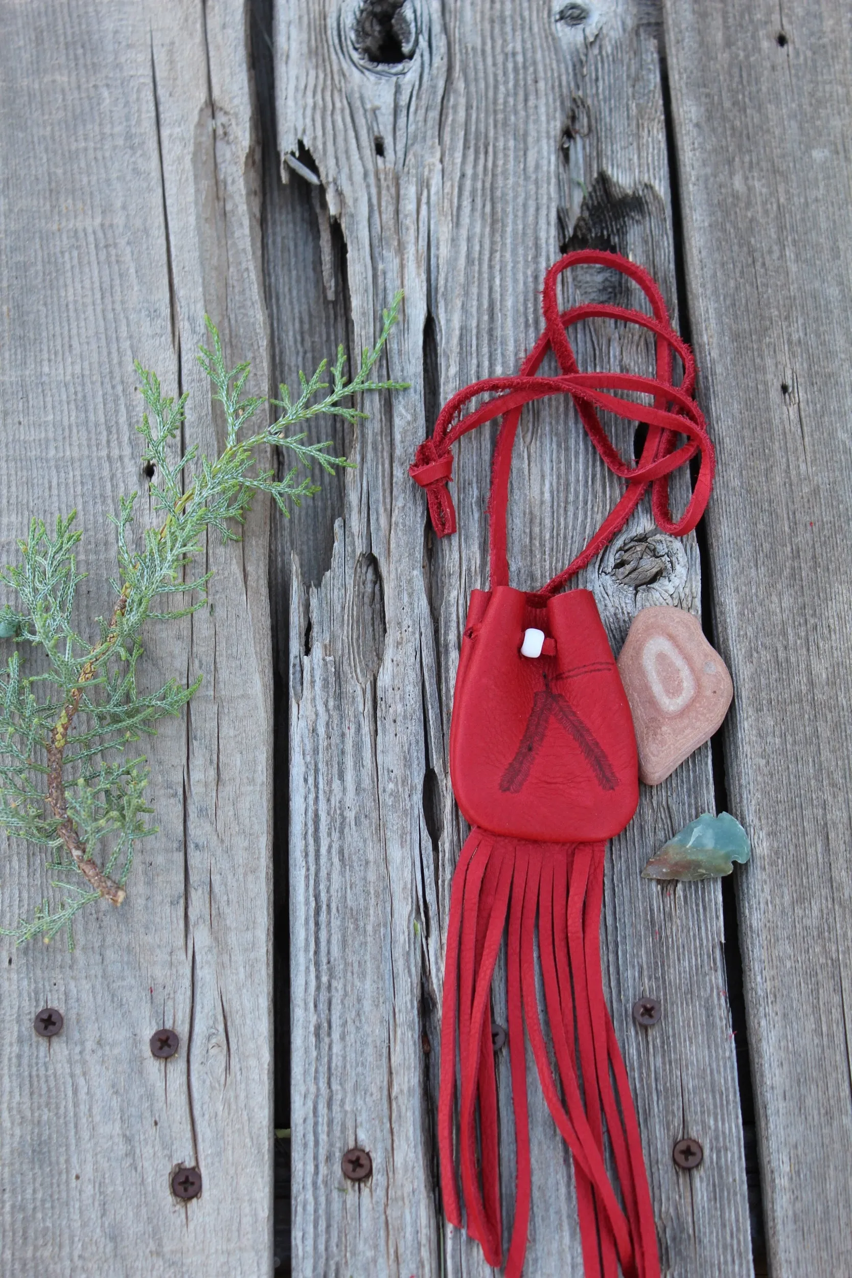 Fringed red leather medicine bag, red leather bag